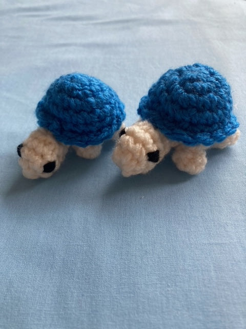 Crochet turtles handmade. Withe white head and legs, and blue shell