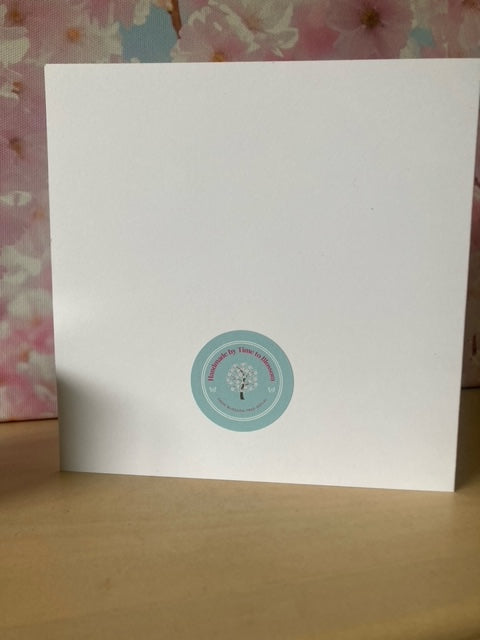 Image of back of handmade birthday card, with stiicker on that reads handmade by time to blossom from blossom tree social