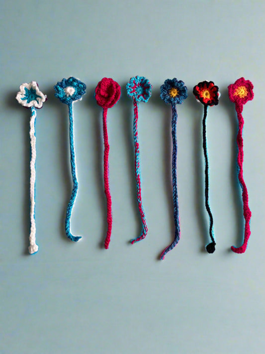 7 handmade crochet bookmarks with flower at the top by time to blossom