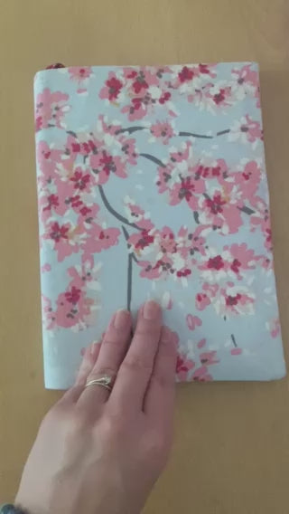 Video showing material notebook cover with notebook inside