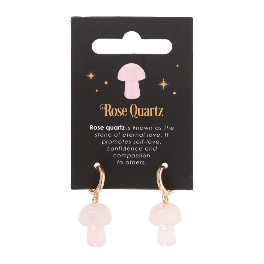 Rose quartz mushroom earrings on card that reads rose quartz is known as the stone of eternal love. It promotes self love confidence and compassion to others